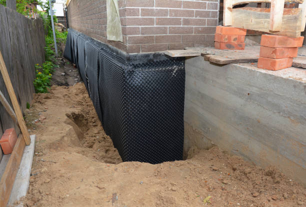 Happy homeowners after waterproofing job in Winneconne